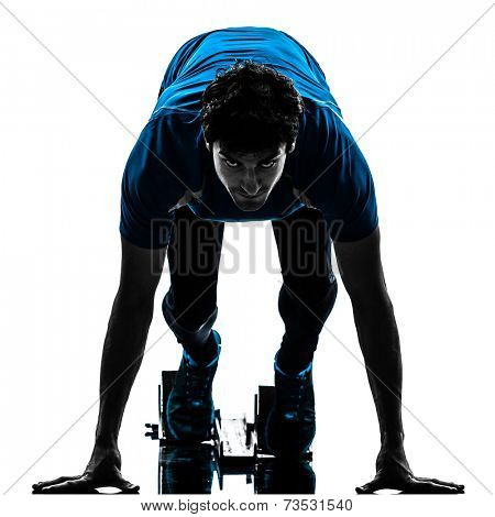 one  man runner sprinter on starting blocks in silhouette studio isolated on white background