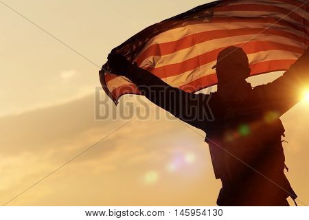 American Flag Celebration. Navy Soldier with United States of America Flag in Hands. Military Concept.