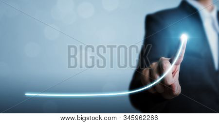 Business Development To Success And Growing Annual Revenue Growth Concept, Businessman Pointing Arro