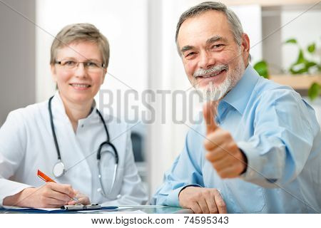 Happy senior patient and doctor at the doctor's office