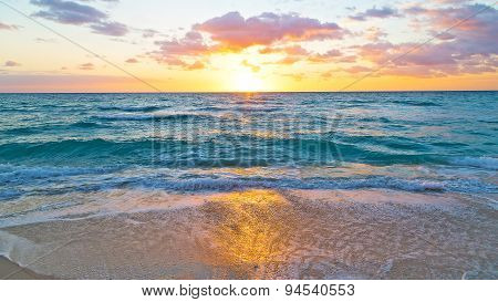 Sunrise and ocean golden wave on Miami Beach, Florida, USA .