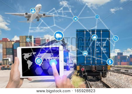 Hand holding tablet is pressing button Logistics connection technology interface global partner connection for logistic import export background. Business logistics concept internet of things