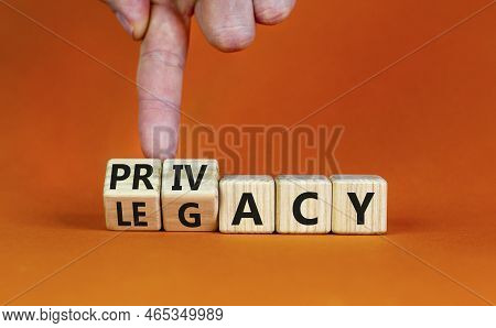 Privacy Or Legacy Symbol. Businessman Turns Wooden Cubes And Changes The Word Legacy To Privacy. Bea