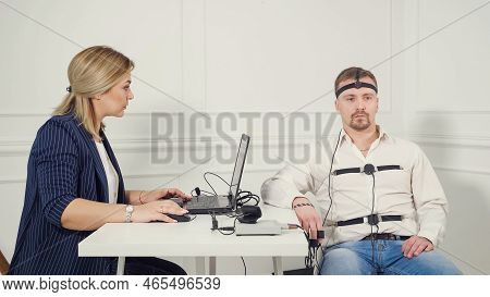 Young Handsome Suspect During Interrogation Undergoes Lie Detector Connected To The Machine He Answe