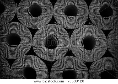 Closeup of Rolls of new black roofing felt or bitumen. Slight vignette