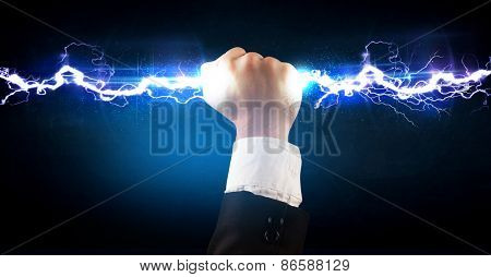 Business man holding electricity light bolt in his hands concept