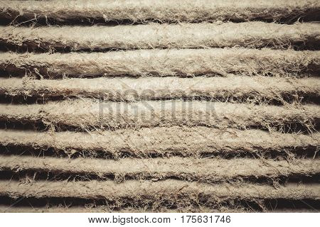 Detailed fragment of dirty air filter surface. Background texture.