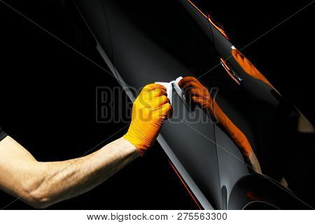 Car Polish Wax Worker Hands Polishing Car. Buffing And Polishing Vehicle With Ceramic. Car Detailing