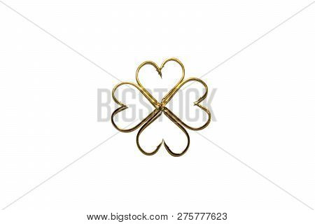 Fishing Hooks In Gold Color. Different Patterns Of Metal Fishing Hooks. Abstraction. Isolated.