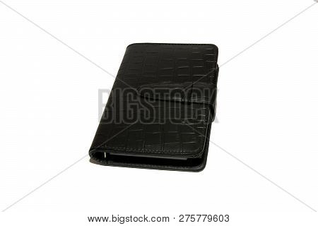 Black Diary Is On A White Table. Diary On White Background. Isolated.