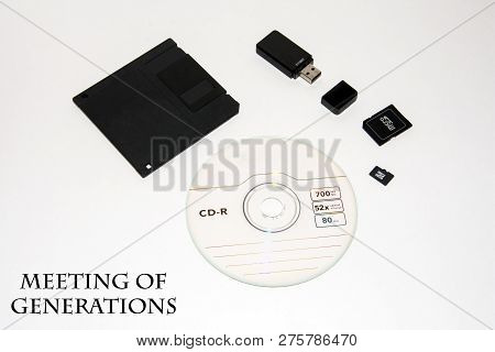 Floppy, Disk, Flash Drive, Memory Card, Micro Card. The Meeting Of Generations. The Concept Of Innov