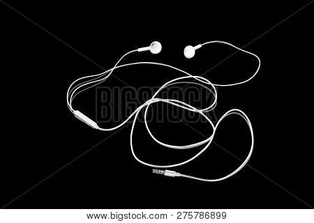 Wired Headphones. Headphones Music On A Black Background. Abstraction. White On Black.