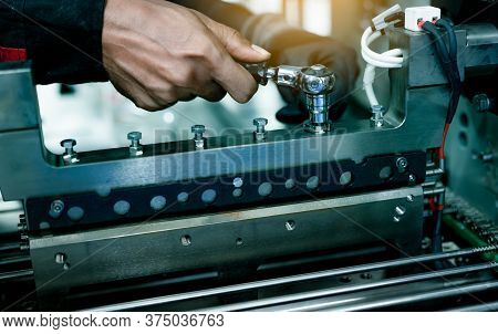 Mechanic Technician Hand Fixing Industrial Machinery In Factory. Professional Technician Service And