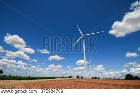 Landscape Of Windmills For Electric Power Production With White Cloud And Blue Sky At Huai Bong, Dan