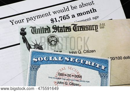 Corner Of Social Security Administration Annual Statement With Social Secuiity Check And Ssn Card.