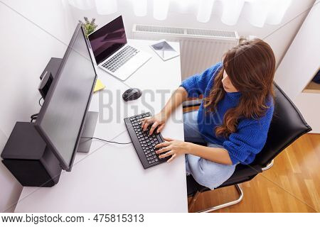 High Angle View Of Female Programmer Coding While Working In Home Office; Female Web Developer Worki