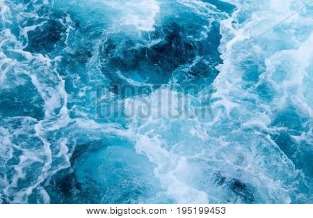 Sea ship trail with foamy wave. Tropical islands ferry travel. Cruiseliner seawater trail. Deep ocean top view. Big ship pitching image. White swirl wave on sea surface. Marine travel banner template