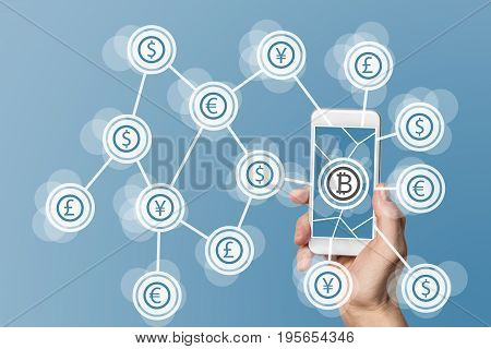 Blockchain and bitcoin technology and mobile computing concept on blue background