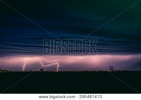 View Of Lightning Strike Over A Rural Farm Field, Lightning Strikes The Ground, Strong Thunder, Ligh