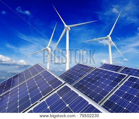 Green alternative energy and environment protection ecology concept - solar battery panels and wind generator turbines against blue sky