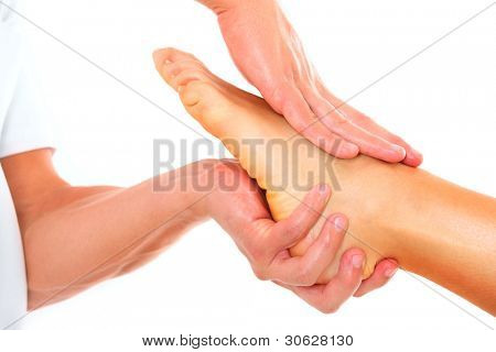 A picture of a physio therapist giving a foot massage over white background