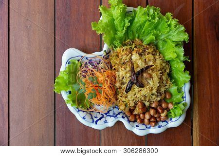 Yam Naem Khao Thot Is Spicy Salad Of Curried Rice Croquettes, Fermented Pork, Ginger And Peanuts On 