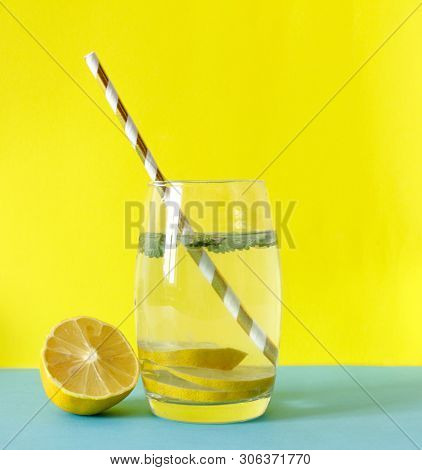 Detox Water. Lemon Water With Mint. Summer Drink. Infused Detox Water In Mason Jar On Yellow Backgro