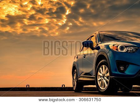 Blue Compact Suv Car With Sport And Modern Design Parked On Concrete Road By The Sea With Beautiful 