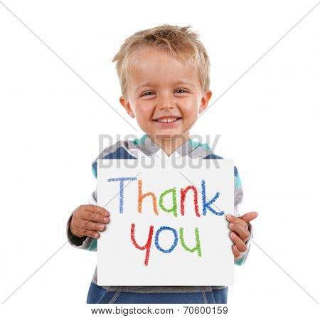 Child holding a crayon thank you sign standing against white background