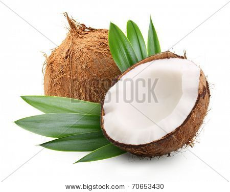 Coconut with palm leaves isolated on white.