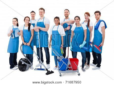 Large Diverse Group Of Janitors With Equipment