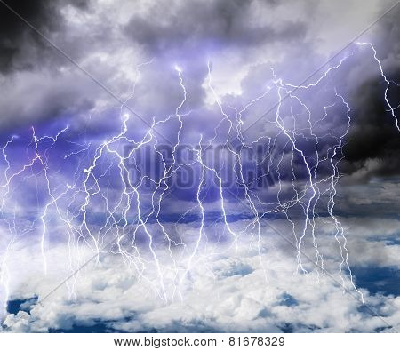 Black Clouds In The Sky Full Of Lightning In A Thunderstorm.