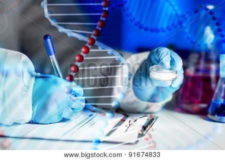 science, chemistry, medicine and people concept - close up of young scientist with chemical sample taking notes on clipboard and making test or research in laboratory over dna molecule structure