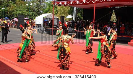 A Group Of Dancers While Performing On The Street Stage, Dancing To Traditional Javanese Dance, Peka