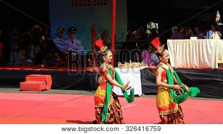 A Group Of Dancers While Performing On The Street Stage, Dancing To Traditional Javanese Dance, Peka