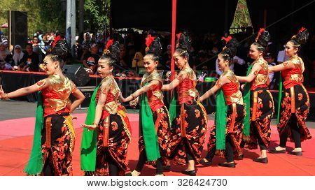 A Group Of Dancers While Performing On The Street Stage, Dancing To Traditional Javanese Dance, Peka