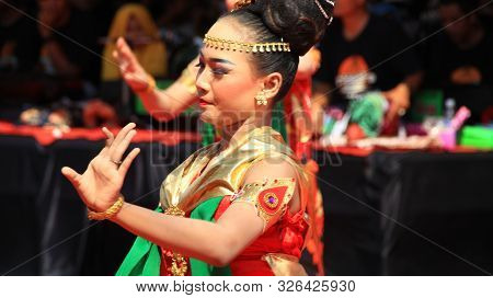 A Group Of Dancers While Performing On The Street Stage, Dancing To Traditional Javanese Dance, Peka