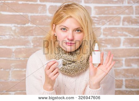 Girl Sick Person Hold Nasal Drops And Tissue. Allergy Concept. Home Treatment. Nasal Drops Plastic B