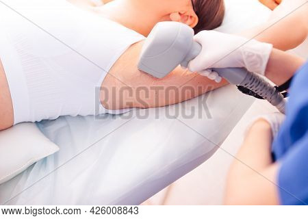 Young Girl Close-up Receiving Laser Epilation Of The Armpit