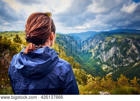 Woman in nature in vacation. People in nature. Hiker woman relaxing in nature in vacation. people. Happy people. Happy beautiful woman in nature in vacation. Woman sitting in meadow in vacation. Woman. People. Vacation. Nature.