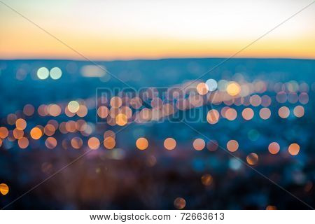 City Blurring Lights Abstract Circular Bokeh On Blue Background With Horizon, Closeup