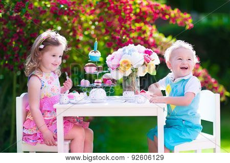 Kids Having Fun At Garden Tea Party