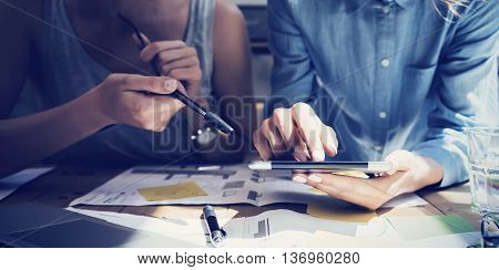 Closeup photo Girl Touching Screen Digital Tablet Hand.Project Producer Researching Process.Business Crew Working New Startup modern Studio.Analyze market stock, strategy.Blurred, film effect.Horizontal