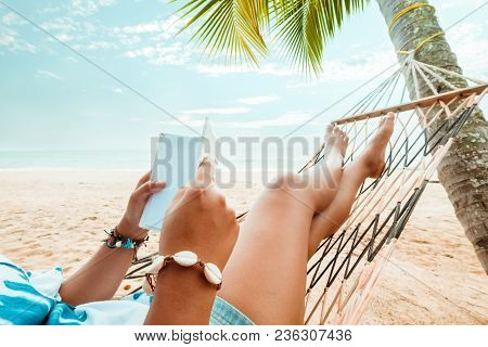 Leisure In Summer - Beautiful Tanned Of Sexy Women. Sunbathe Relax And Reading A Book On Hammock At 