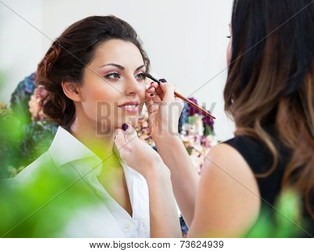 Make-up Artist Doing Make Up For Young Beautiful Bride