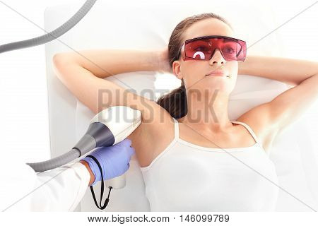 Beauty salon, hair removal laser. Woman on laser hair removal