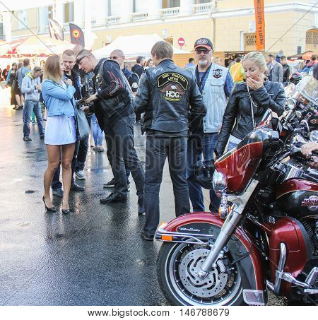 St. Petersburg, Russia - 12 August, People communicate on holiday,12 August, 2016.
The annual International Festival of Motor Harley Davidson in St. Petersburg Ostrovsky Square.