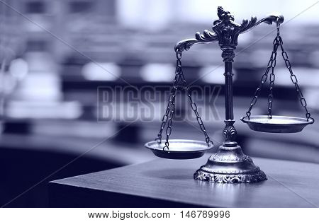 Symbol of law and justice in the empty courtroom law and justice concept.