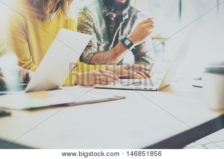 Coworkers Team Work Process Modern Interior Loft Office.Creative Producers Making Great Decisions New Idea.Young Business Crew Working Startup.Documents Wood Table.Analyze Reports.Blurred Film Effect