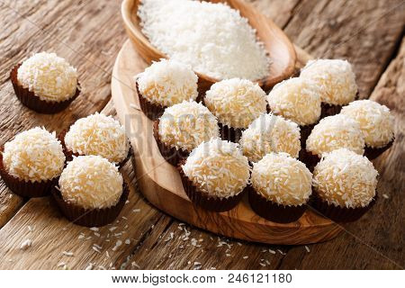 Children's Festive Candy Beijinhos De Coco Or Branquinhos With Condensed Milk And Coconut Close-up. 